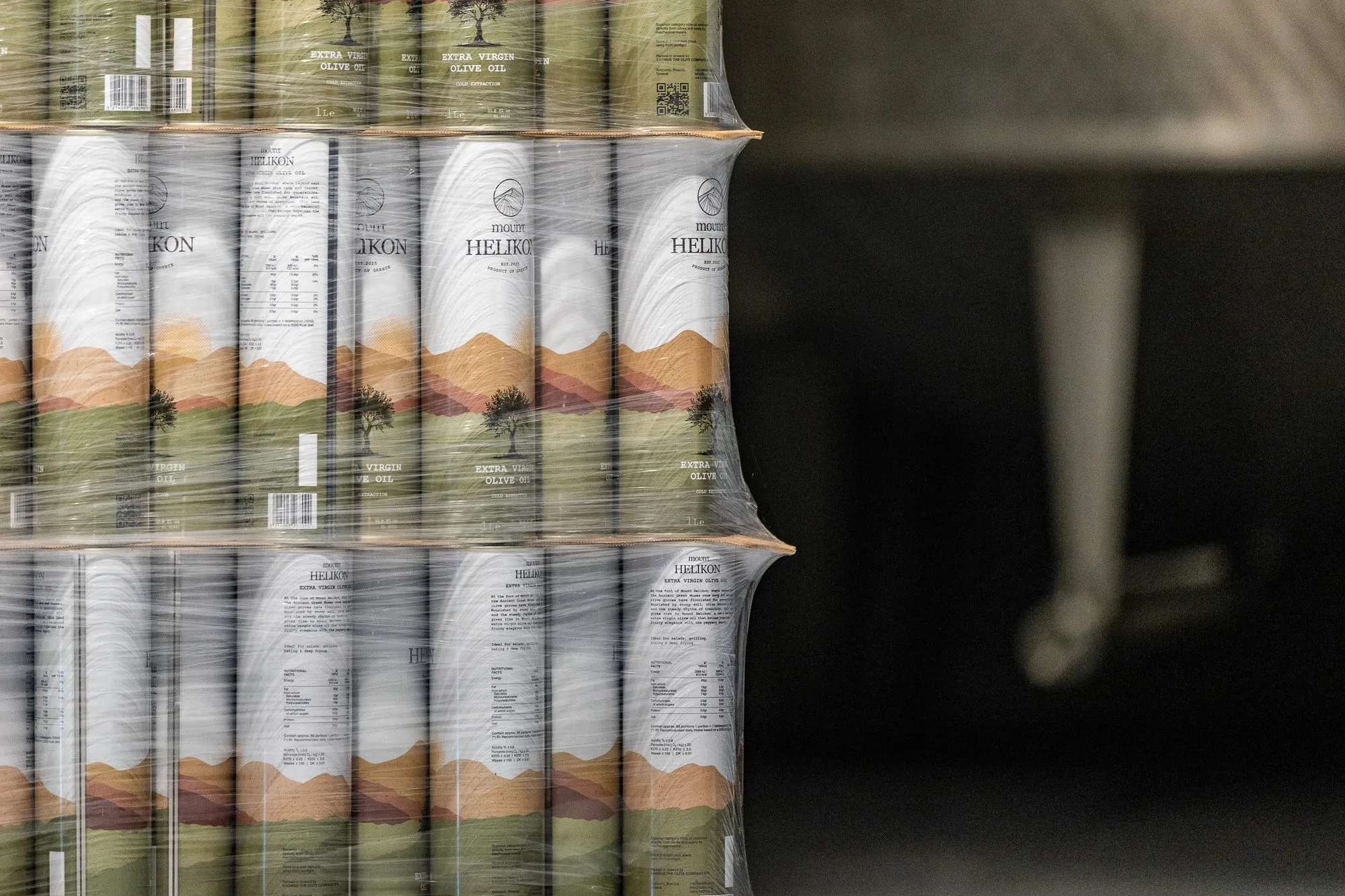 Wrapped tins of olive oil stacked at the mill, ready to ship